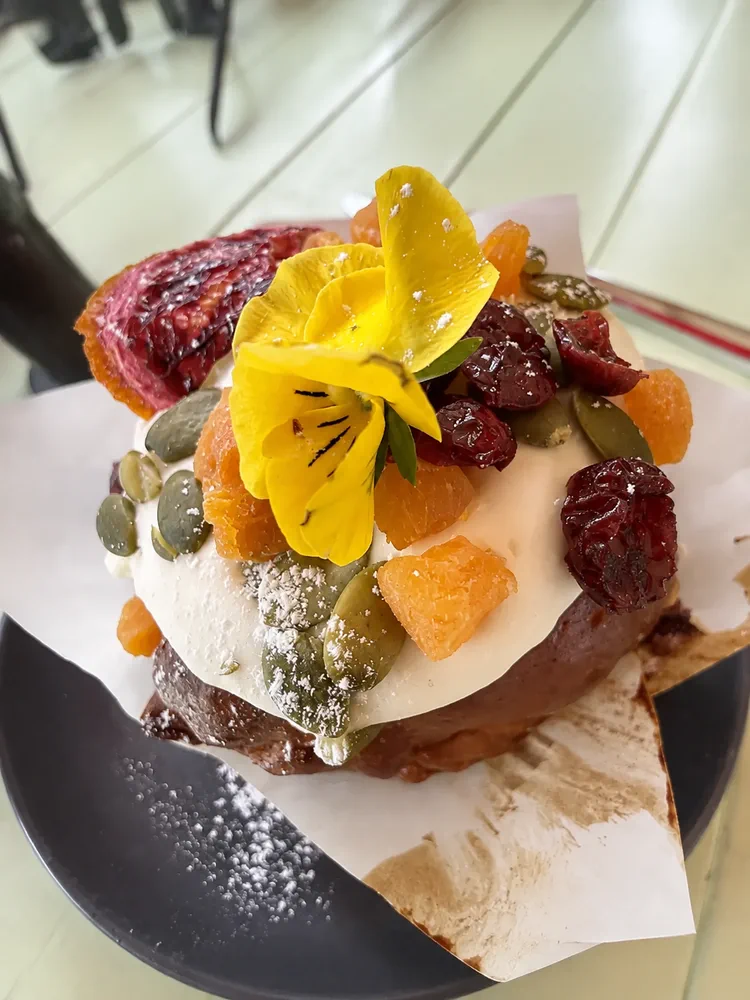 Floral dessert with fruit and an edible yellow flower
